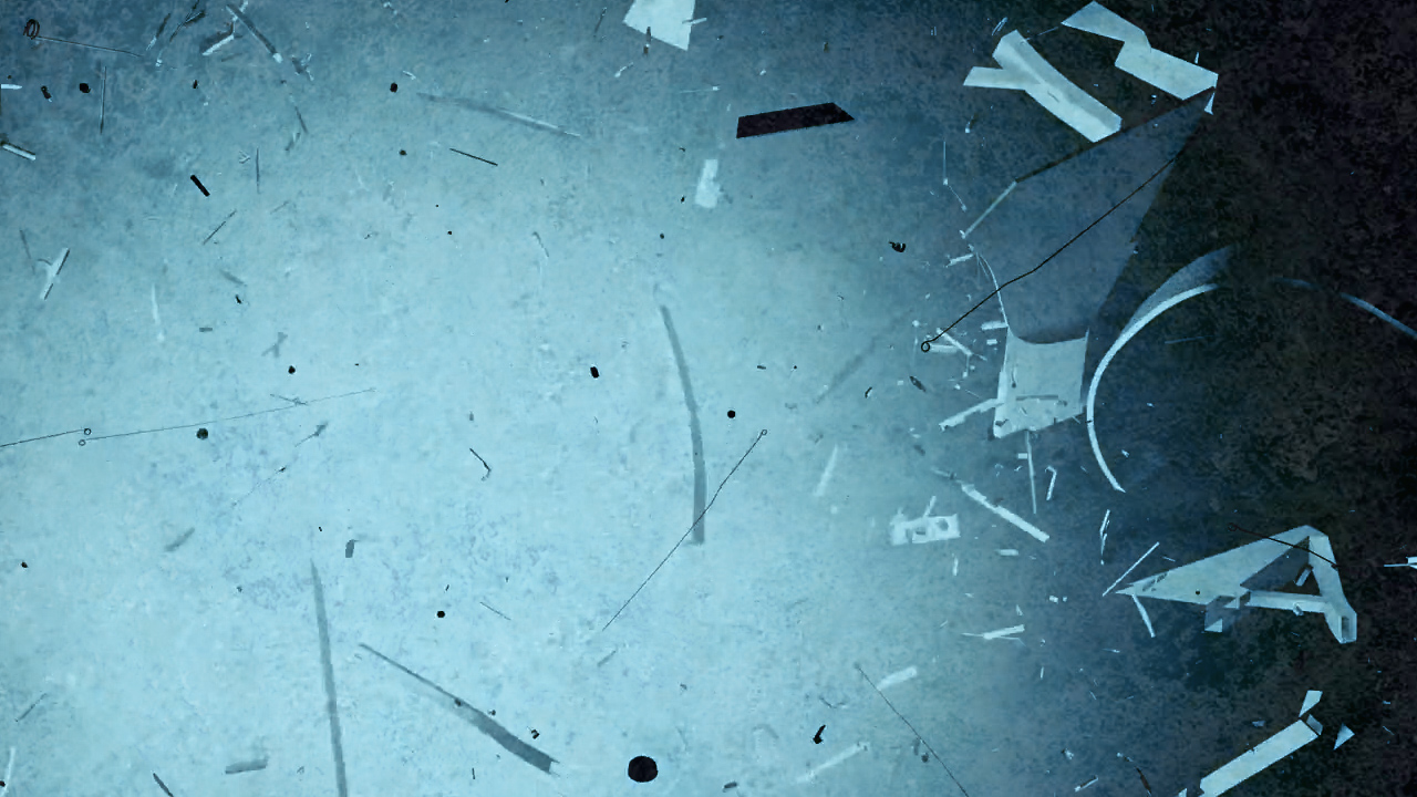 Pale blue space surrounded by suspended fragments of a deconstructed piano